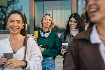 College friends enjoy the walk through the campus together