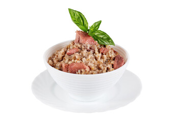 Canned barley porridge with meat and basil in a bowl