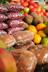plastic-packed bread in the middle of the fruit and vegetable market for sale