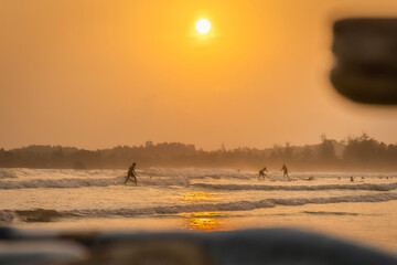 surfer at the sunset on the beach