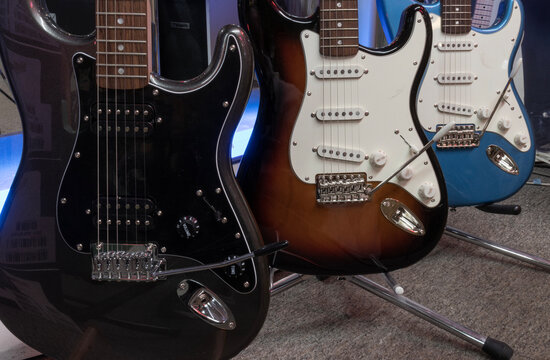 Fender Stratocaster guitar display at a music store. Strats are world renowned for their distinctive clean sound.