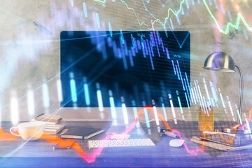 Financial chart drawing and table with computer on background. Multi exposure. Concept of international markets.