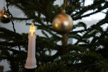 Lights and decorations on a christmas tree.