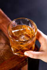 whisky on the rocks on wood
