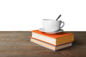 Cup of coffee with book on wooden table