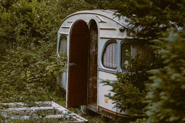 Urban exploring caravan in the woods