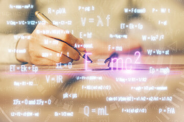 Science formula hologram over woman's hands taking notes background. Concept of study. Multi exposure