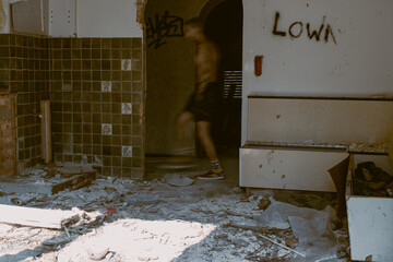 Person walking in an abandoned building 