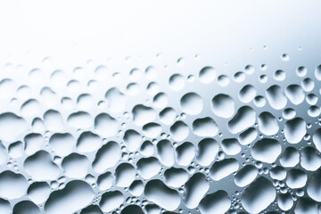 Water drops on white background texture. backdrop glass covered with drops of water. bubbles in water. Cells, drops of water on glass, close up macro view,water is life,selective focus.