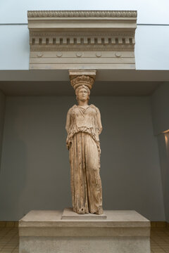 The British Museum. Caryatid (Karyatis) and abacus from the Erechtheion, Acropolis of Athens, Greece. Sculpted female figure, Greek woman acted as a pillar and architectural support.