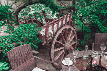 Restaurant balcony interior with vintage wooden wagon