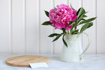 mockup, the creator of the scene with a pink peony on the table. empty space for your object.