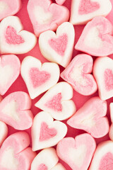 Obraz na płótnie Canvas Pink and white candy heart love background