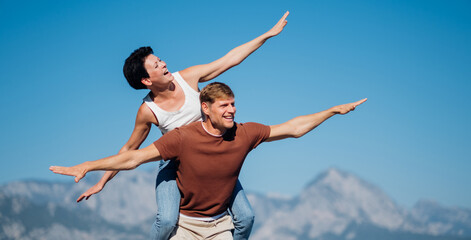 Couple in love opened their arms like the wings of an airplane. Trave concerts.