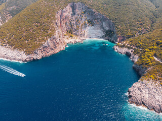 Drone shot of Zakynthos island with beautiful turquoise Ionian sea and limestone cliffs near famous Navagio beach during daytime - 560535776