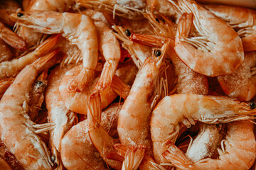 Shrimps are frozen in large quantities, seafood is fresh, many with ice. Fresh shrimps, fish department