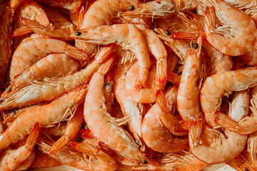 Shrimps are frozen in large quantities, seafood is fresh, many with ice. Fresh shrimps, fish...