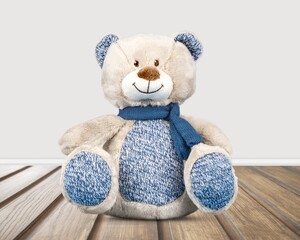 Cute soft toy bear on the desk.