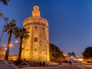 Fototapeta na wymiar Golden tower, Torre del Oro, at sunset in Seville, Andalusia. Spain.