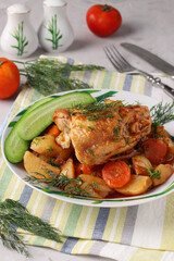 Chicken thighs cooked with potatoes and carrots, Close-up