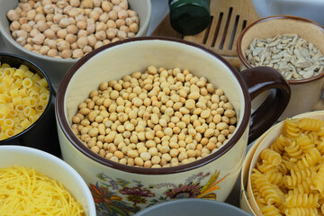 Soy in bowl. Protein pulse that is dried and then soaked and cooked before eating. Vegan organic product.