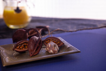 Still life with dried fruits in blue and yellow tones