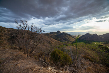 Monsoon clouds above rugged desert peaks in Arizona