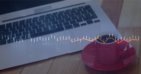 Image of financial data processing over laptop