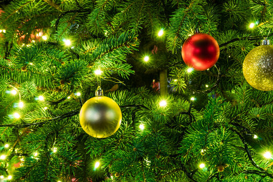 Full frame close-Up of Christmas baubles and Christmas lights on a Christmas tree