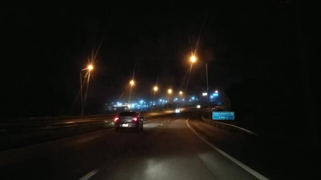 Cellphone shot from a man driving at night on the way to airport in ghostly Brazilian city of Belo Horizonte