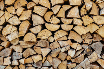 Chopped firewood is stacked in a big pile