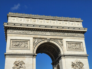 Fototapeta na wymiar Arc de Triomphe with clear blue sky in low angle