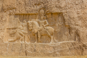 Triumph of Shapur I over the Roman emperors Valerian and Philip the Arab bas-relief in Naqsh-e...