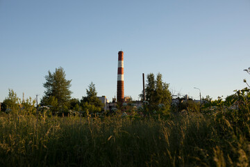 Fototapeta na wymiar Pipe factory. Boiler station pipe. Rural landscape.