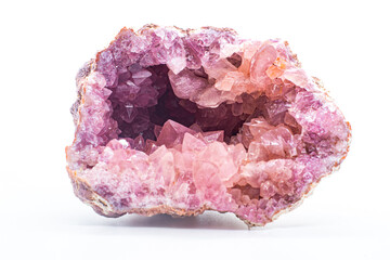 Macro focused vibrant pink amethyst quartz geode crystal, rose hematite amethyst points isolated on...