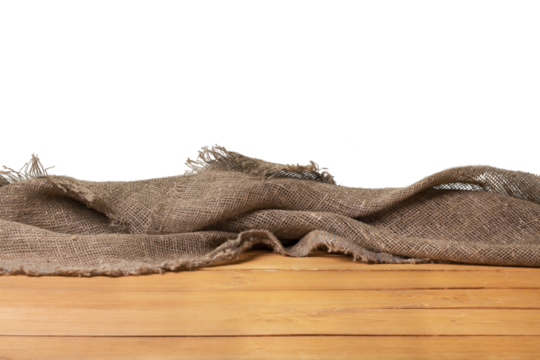 Old wooden table with a piece of burlap