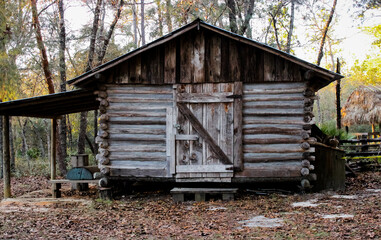 A shed in the woods that is locked