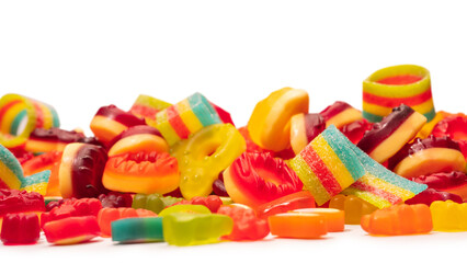 Assorted colorful gummy candies. Top view. Jelly donuts. Jelly bears. Isolated on a white background.