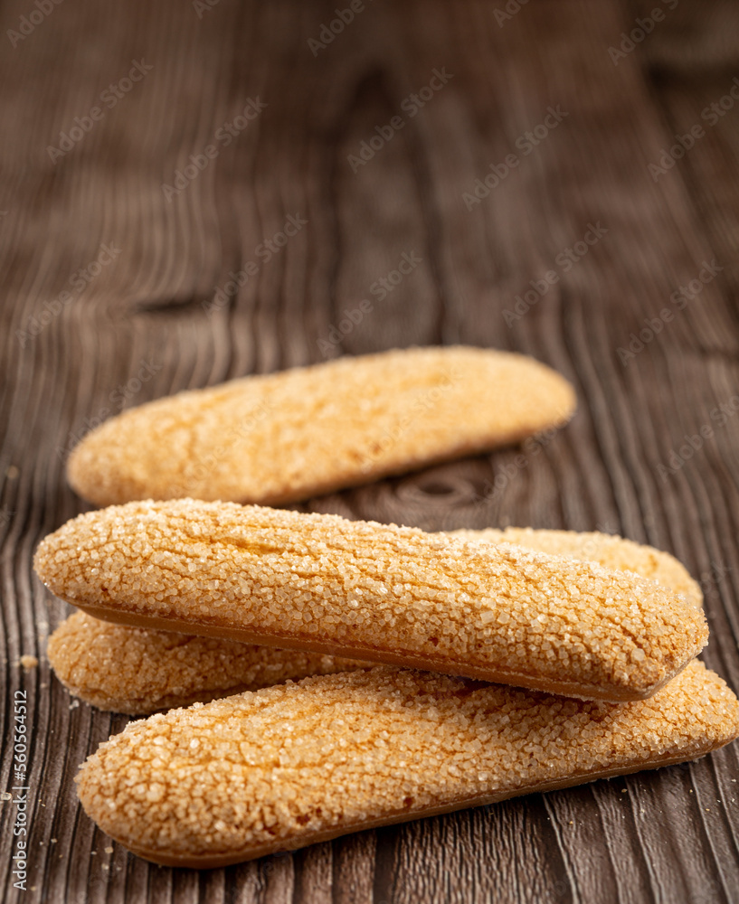 Poster ladyfingers cookies on the table.