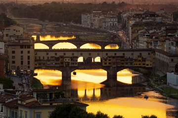 Fototapeta na wymiar Florence bridges at sunset taken in May 2022
