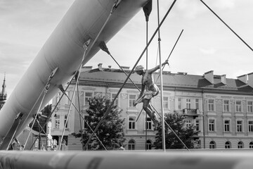 Sculpture statue of circus gymnast on the bridge 