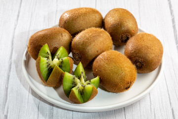 Fresh Kiwi fruit on the table.