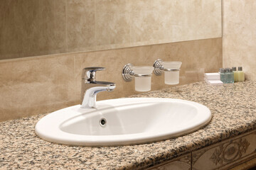 Fototapeta na wymiar Interior bathroom with sink basin faucet, open chrome faucet washbasin. modern design of bathroom.