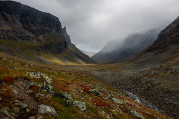 Fototapeta premium Mysterious foggy Nallo Massif along the hiking train between Nallo and Salka mountain huts, Lapland, Sweden