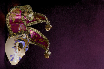 Picture of Venetian mask on dark purple background