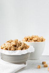 Nigerian Chin chin in a ceramic bowl, Fried chin-chin snack in a bowl, Nigerian party food and small chops