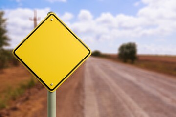 Big yellow road sign at autumn background