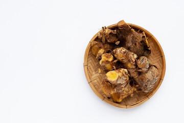 Phlai slices, Cassumumr ginger or zingiber montanum in bamboo weave plate on white background.