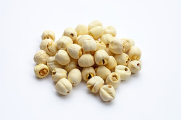 Dried lotus seeds on white background.