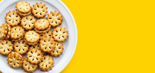 Pineapple biscuits on yellow background.